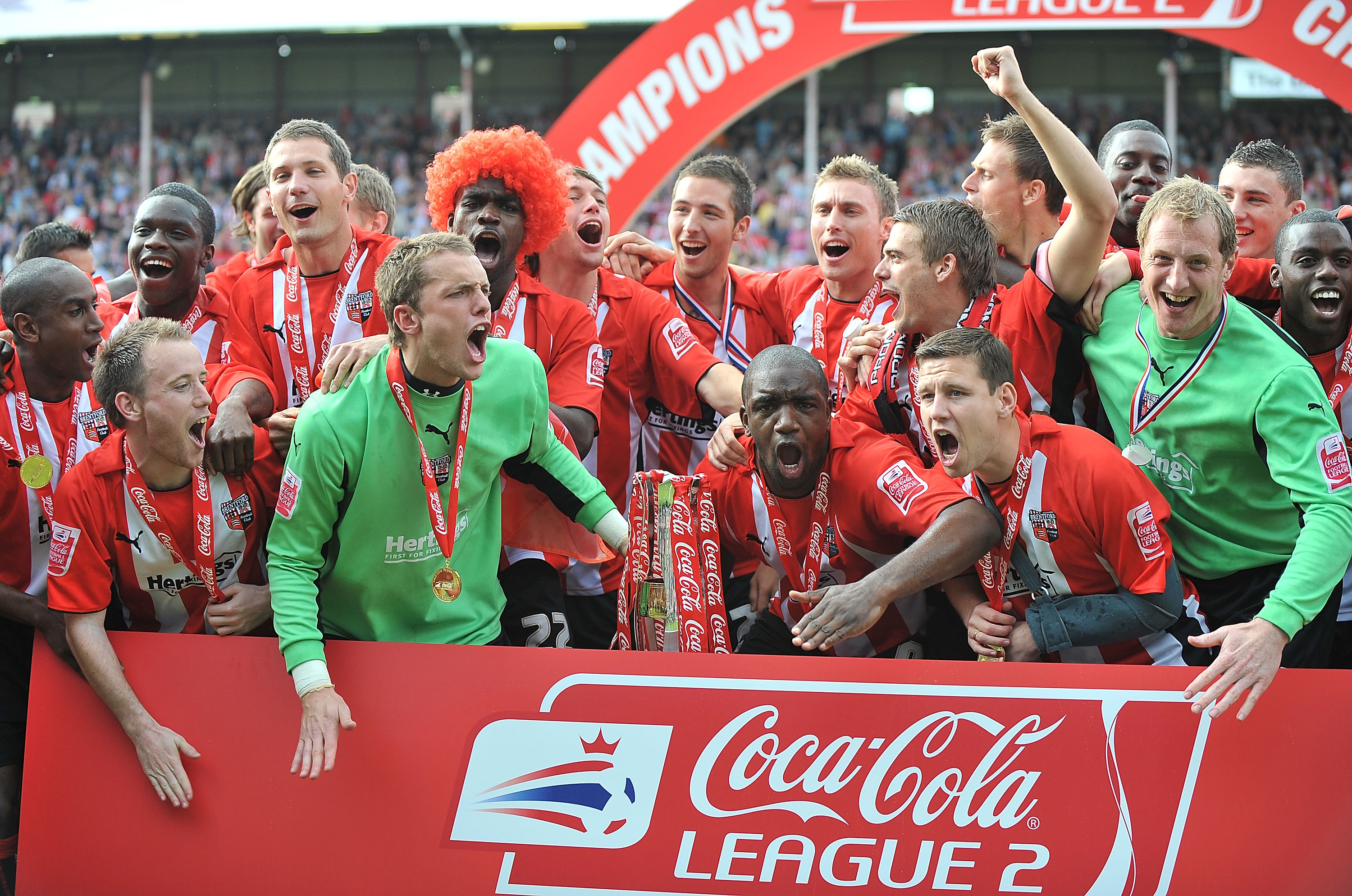 Adam Newton and Brentford celebrate winning League Two in 2009