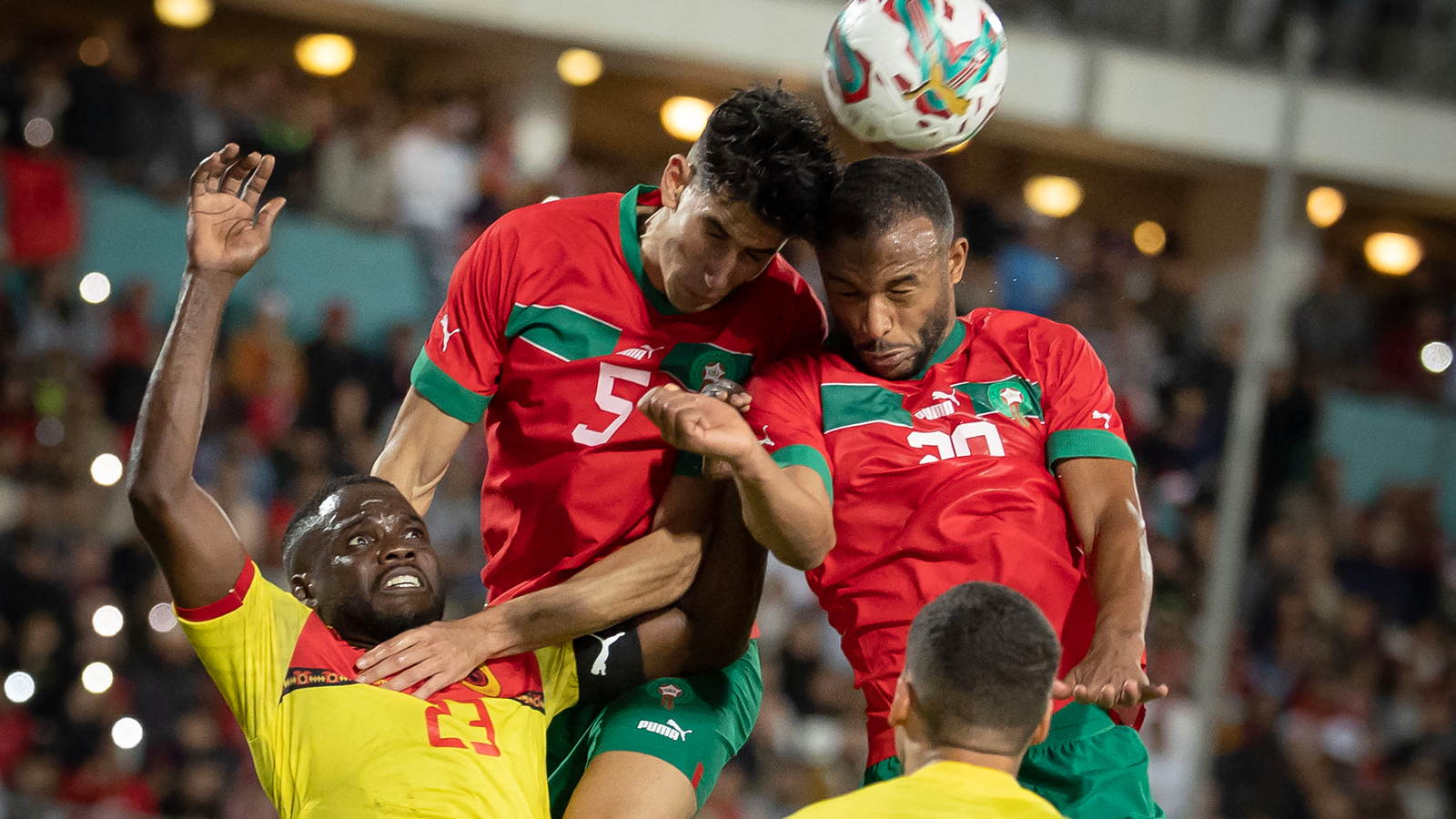 Nayef Aguerd wins a header in Morocco's game against Angola