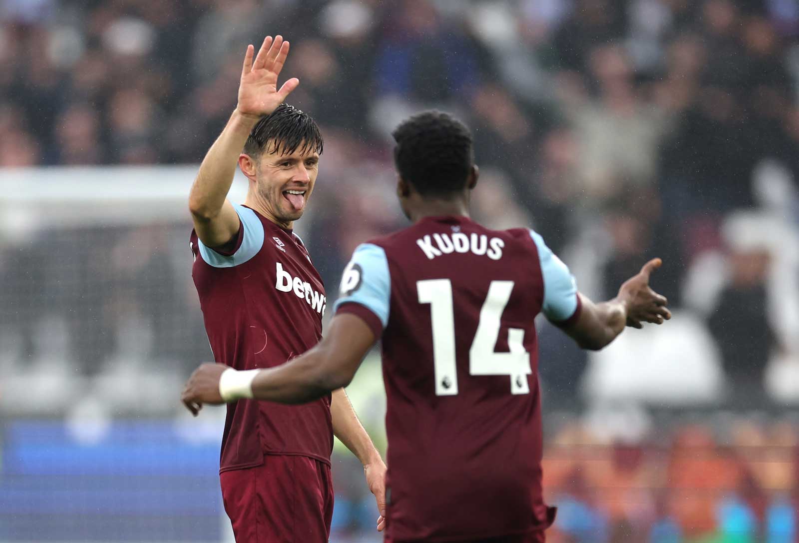 Aaron Cresswell celebrates with Mohammed Kudus after the No14 laid on Danny Ings' equaliser against Burnley