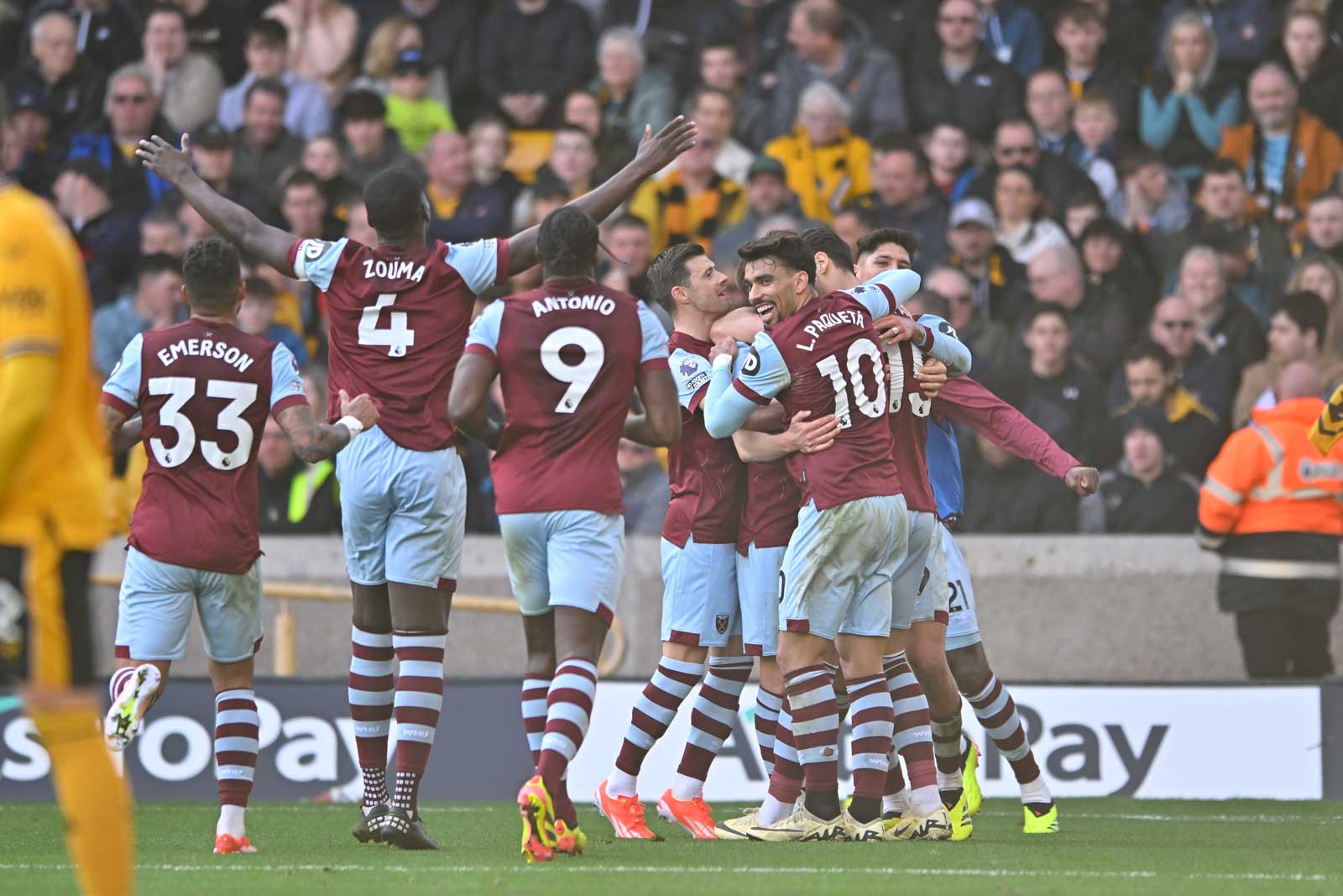 The Hammers players celebrate their winning goal at Wolves