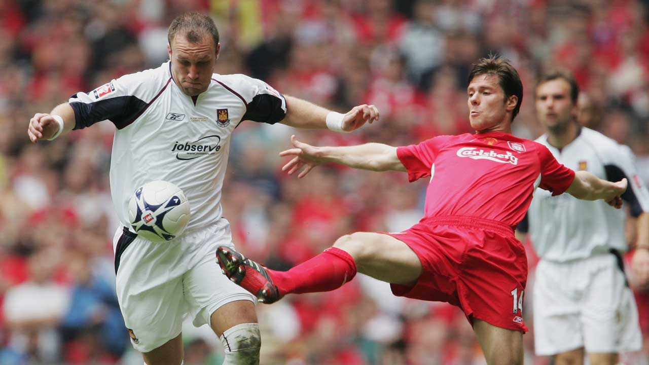 Xabi Alonso challenges Dean Ashton during the 2006 FA Cup final
