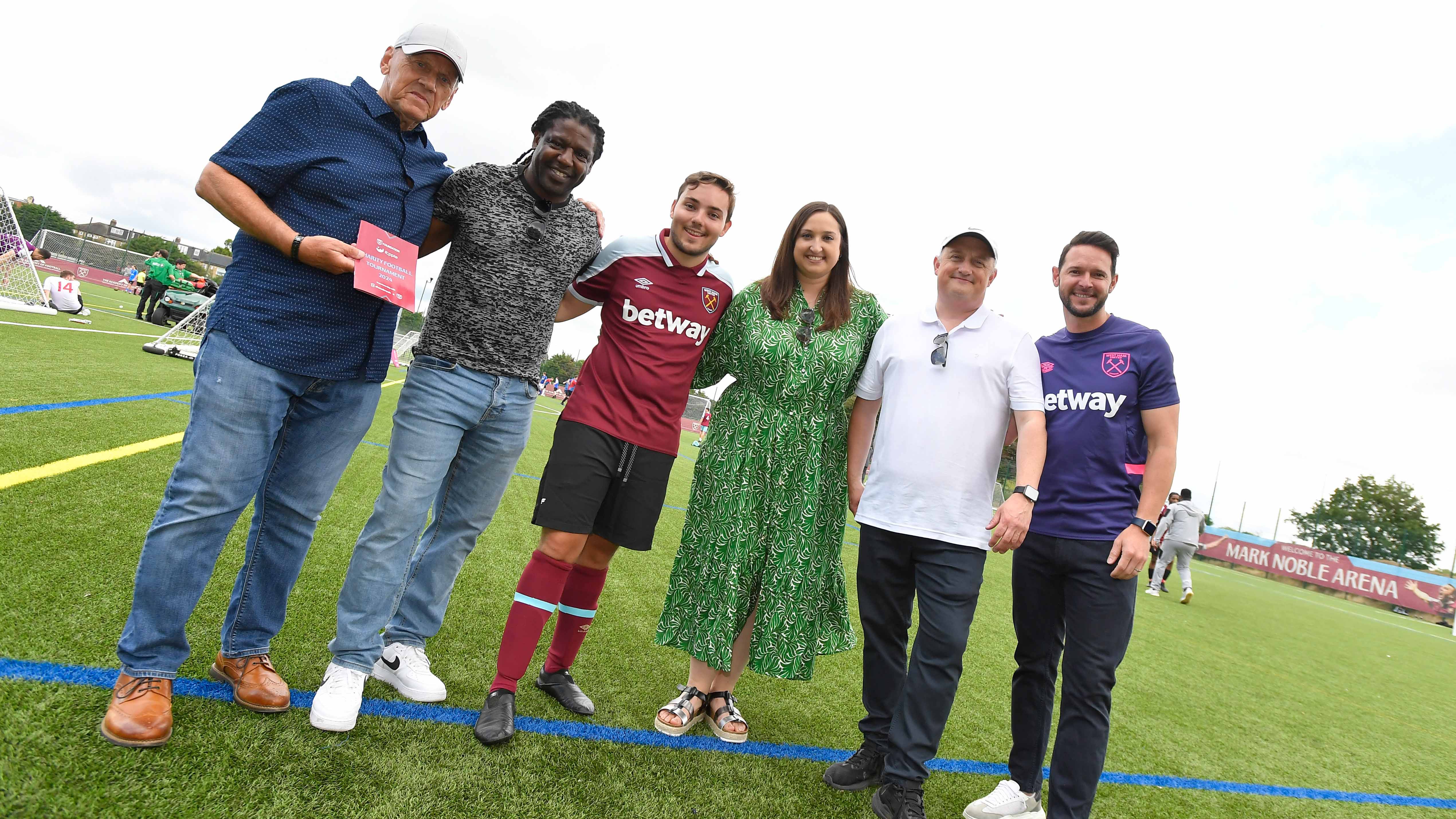 Alice Hendey poses with partners and West Ham players at Charity Tournament