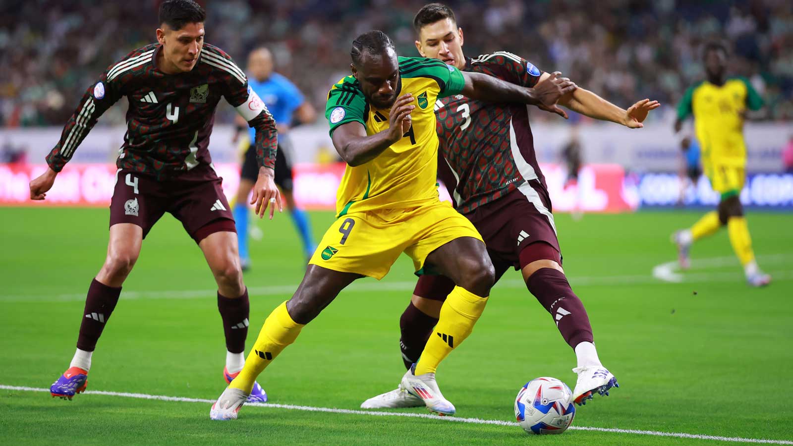 Michail Antonio is tracked by Edson Álvarez in Jamaica's Copa América meeting wth Mexico