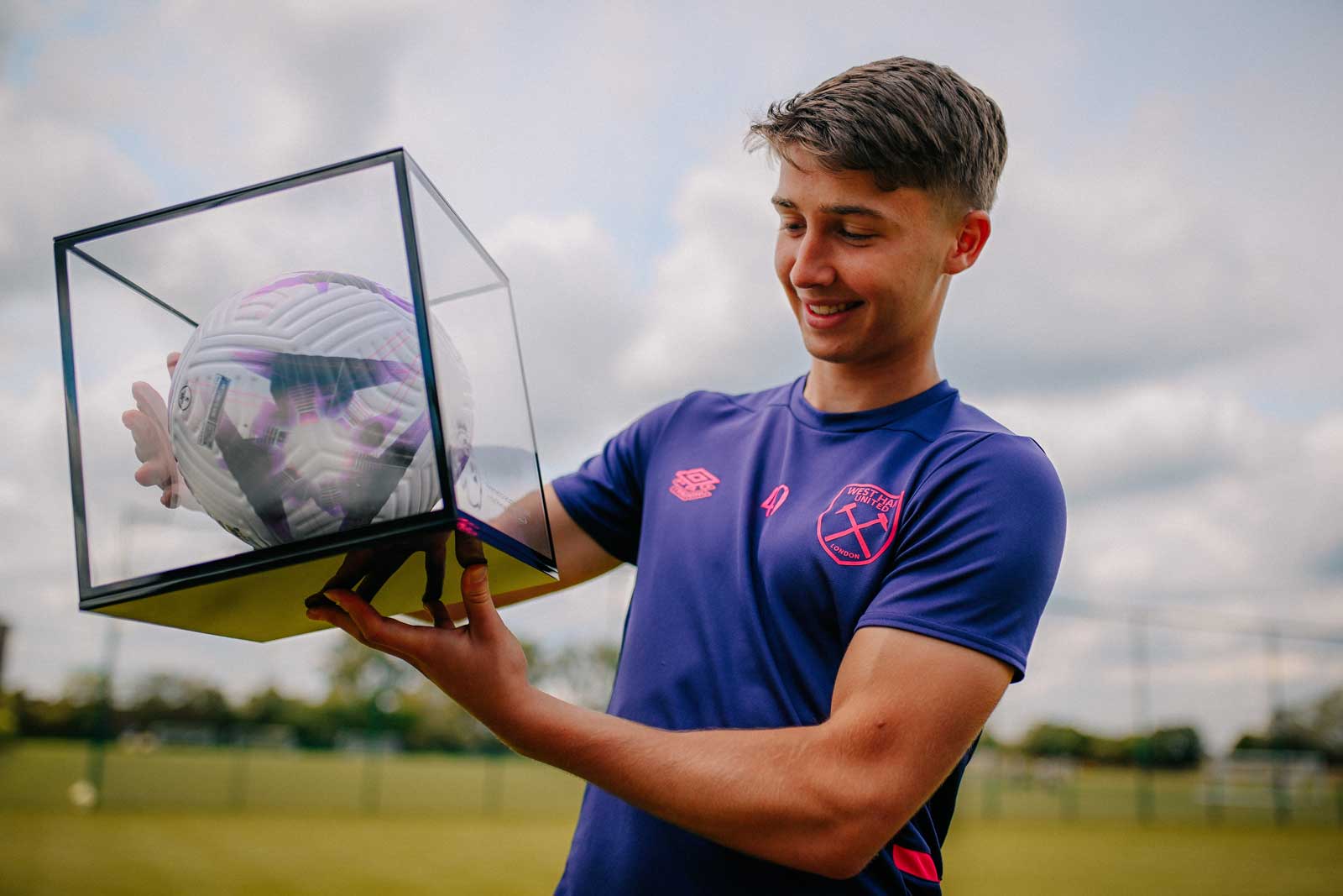 George Earthy with his Premier League debut ball