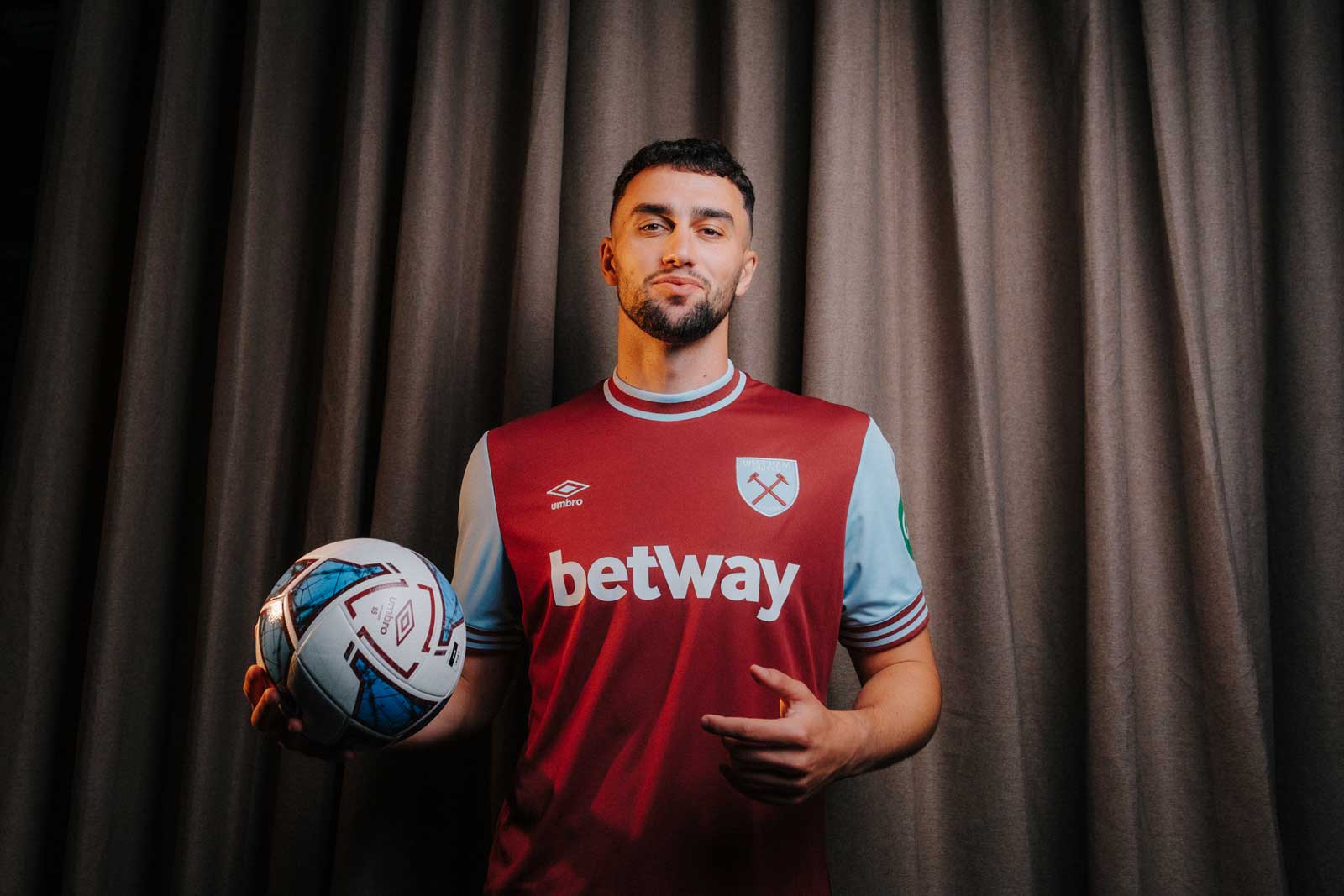 Maximilian Kilman poses in the 2024/25 West Ham United Home Kit