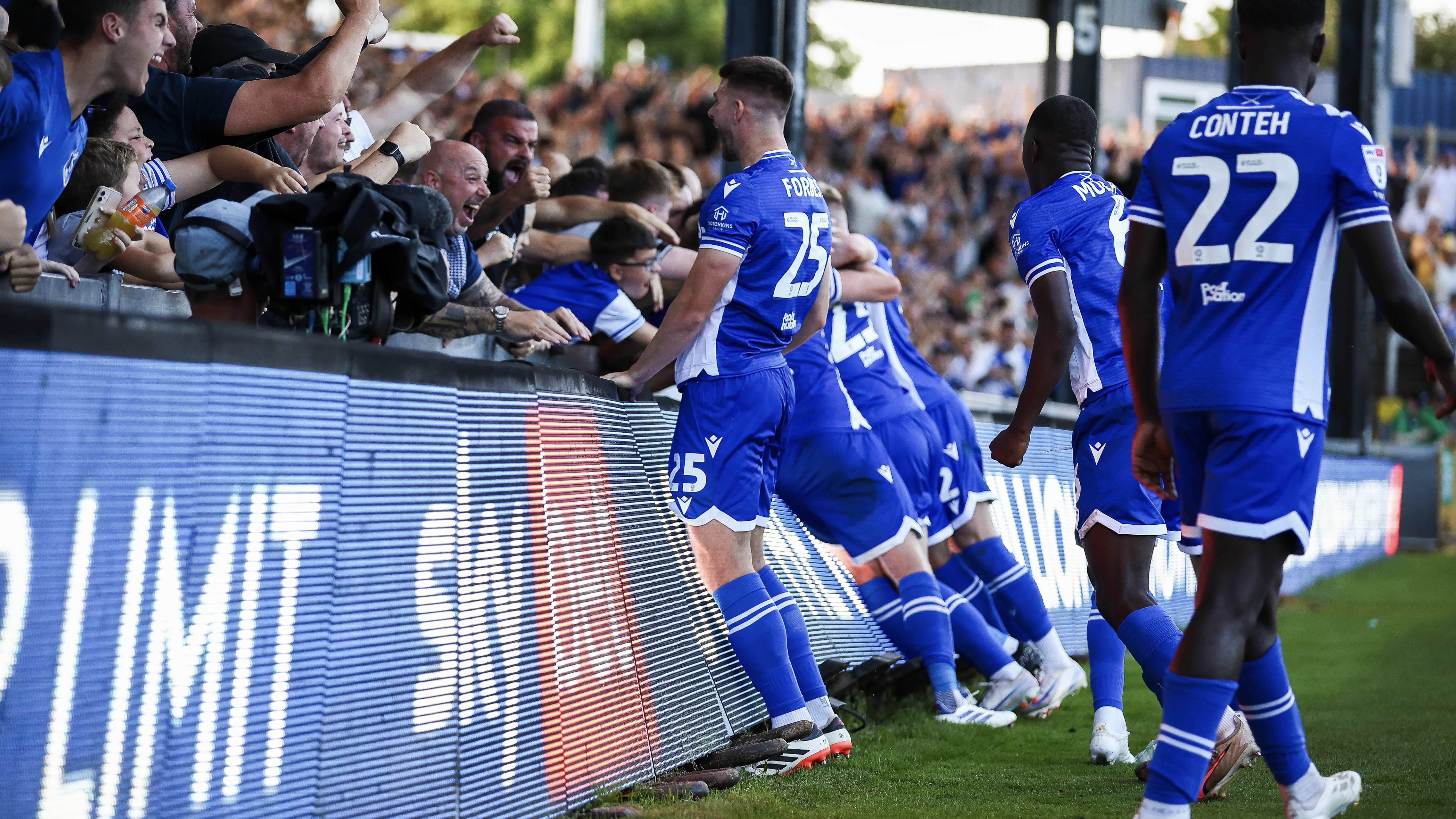 Michael Forbes celebrates with Bristol Rovers teammates