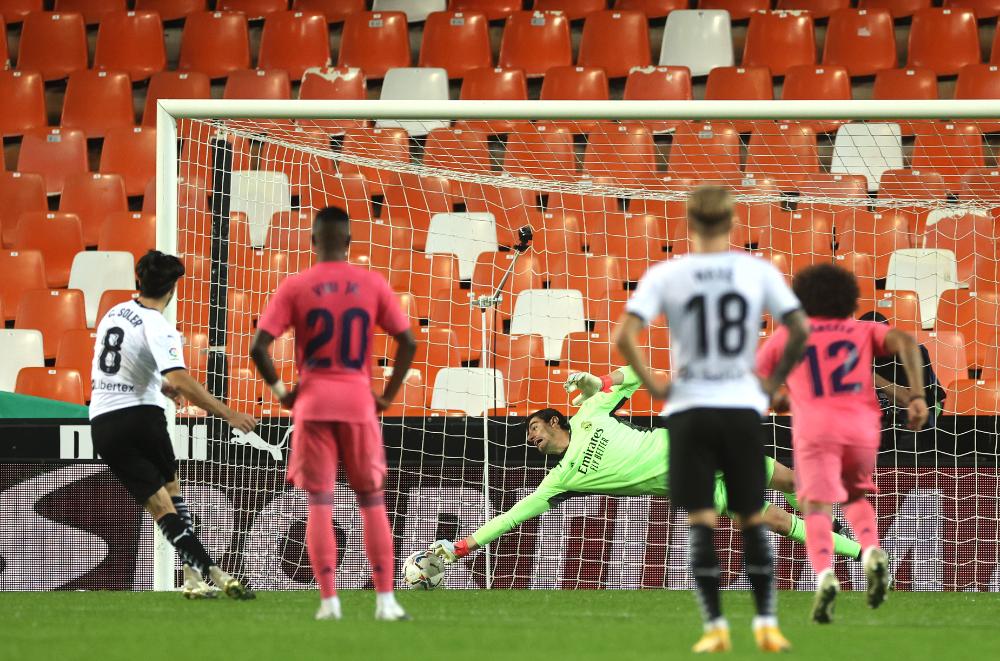 Carlos Soler scores a penalty against Real Madrid