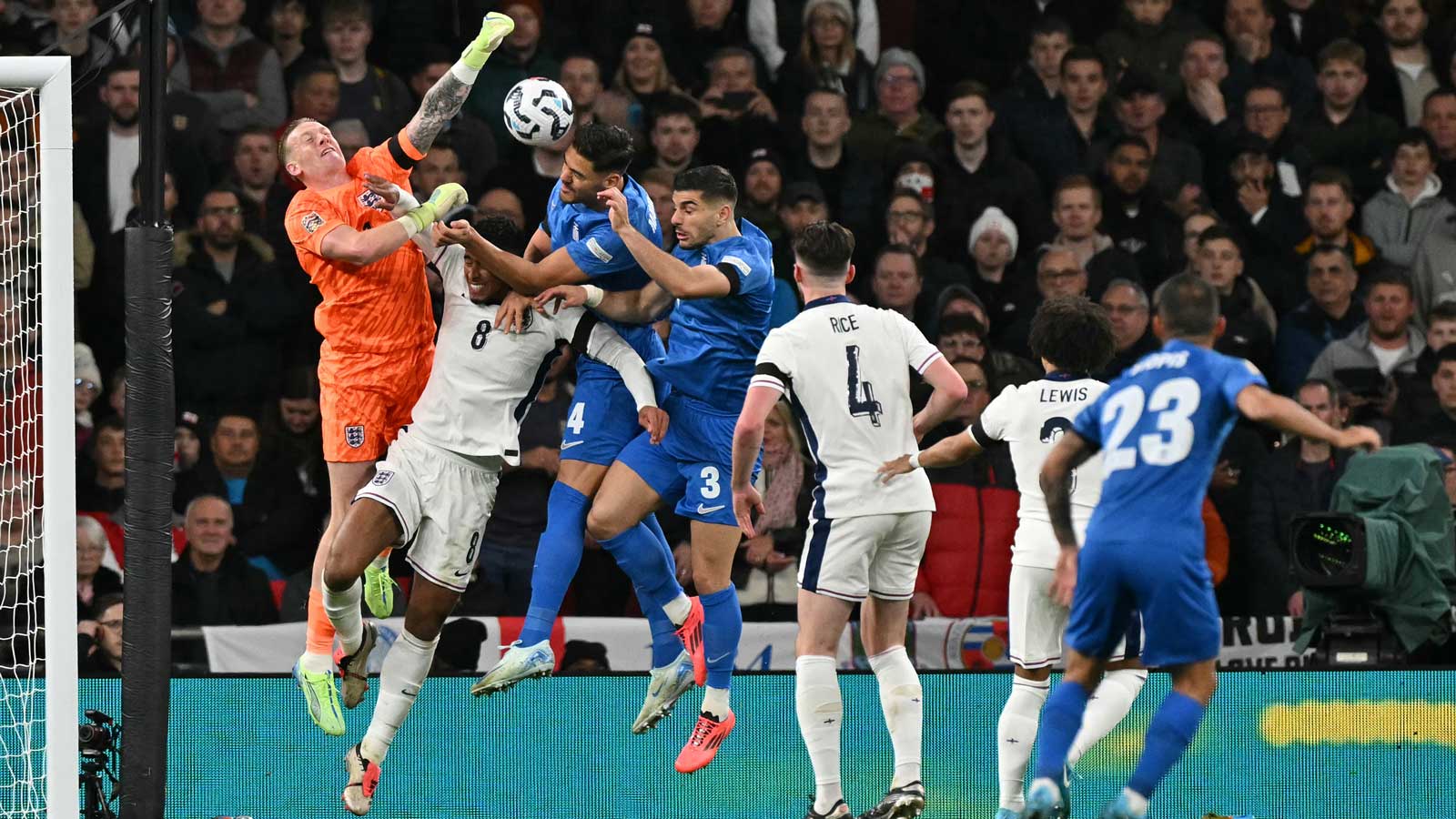 Dinos Mavropanos challenges Jordan Pickford for a header