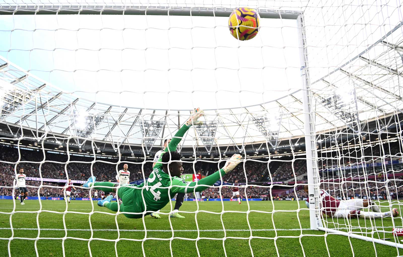 Crysensio Summerville slides in to score against Manchester United