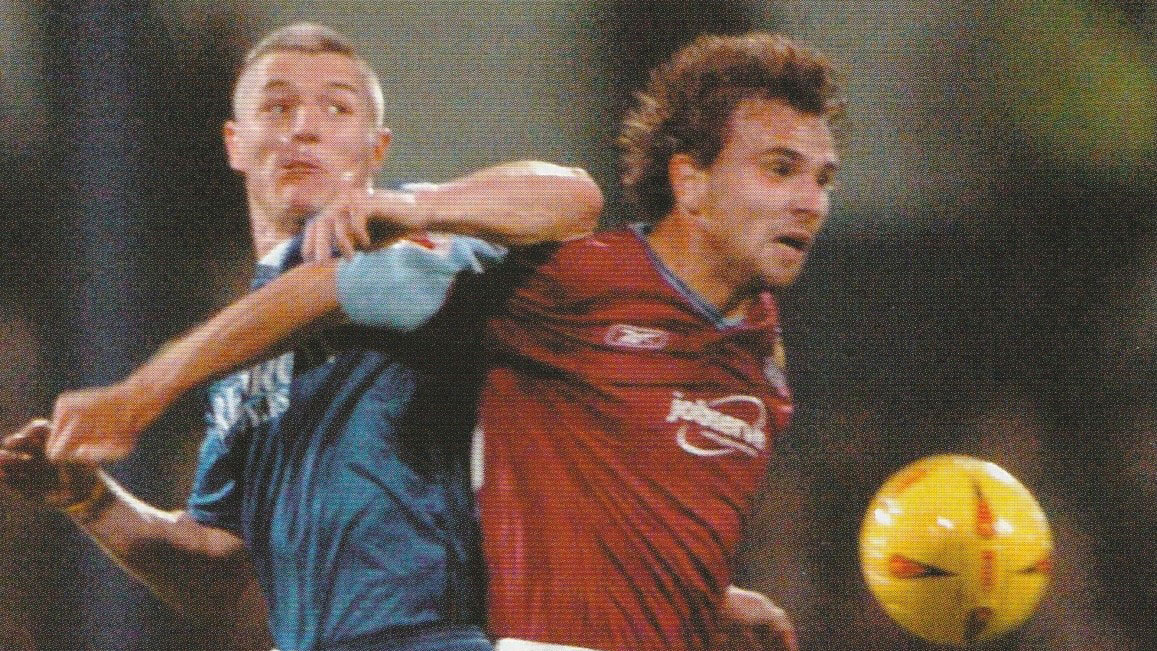 Carl Fletcher challenges Cardiff's Graham Kavanagh