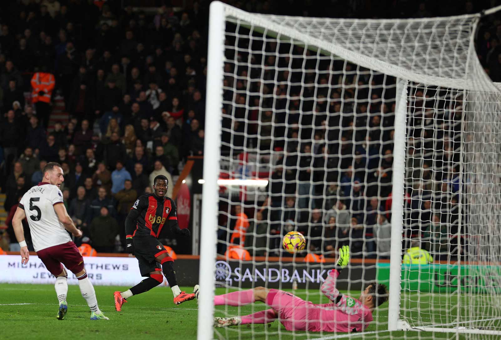 Łukasz Fabiański saves from Dango Ouattara in the first half at Bournemouth