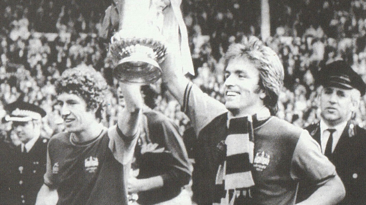 Pat Holland enjoys a Wembley lap of honour with Billy Jennings in 1975