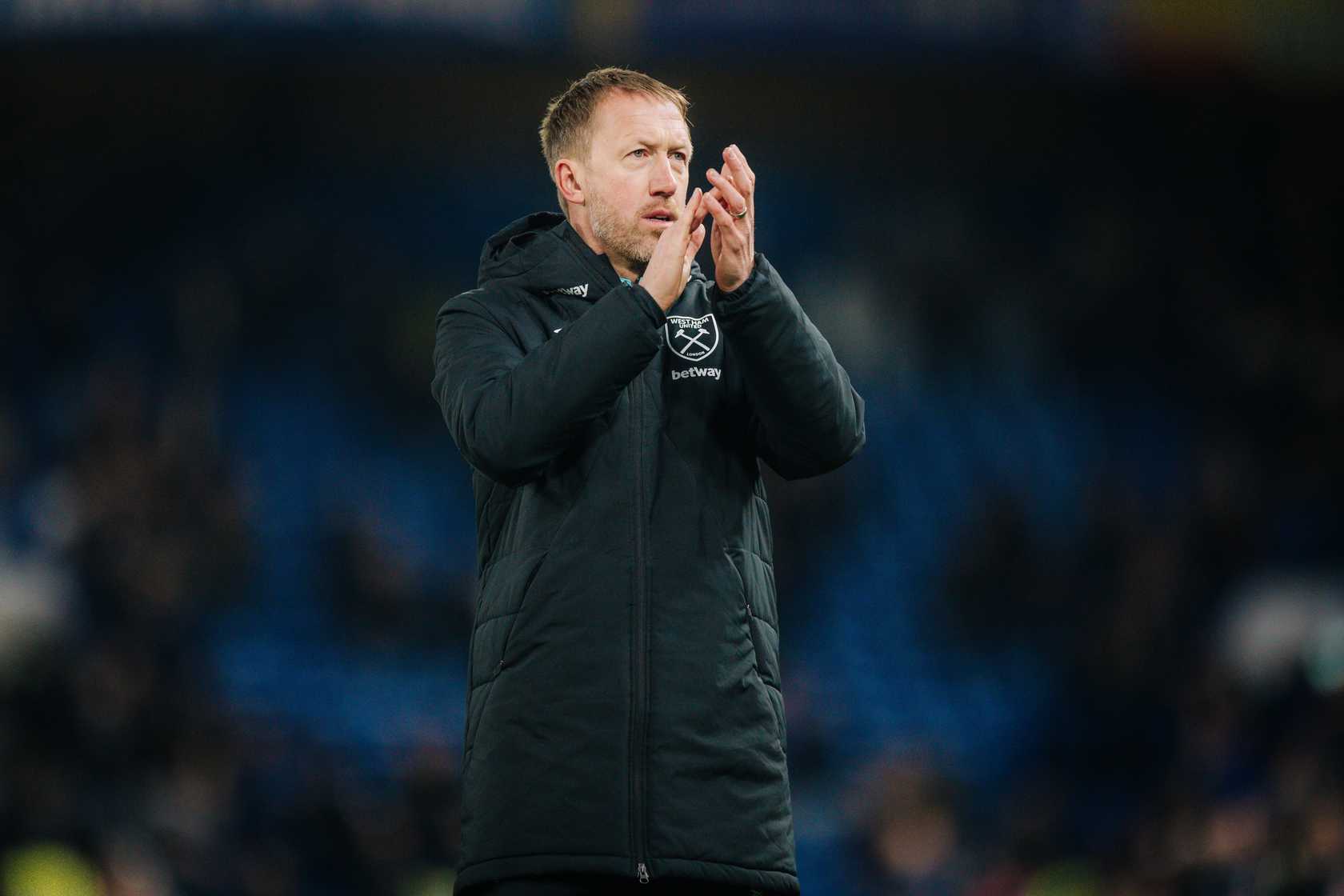 Graham Potter applauds the supporters at Chelsea