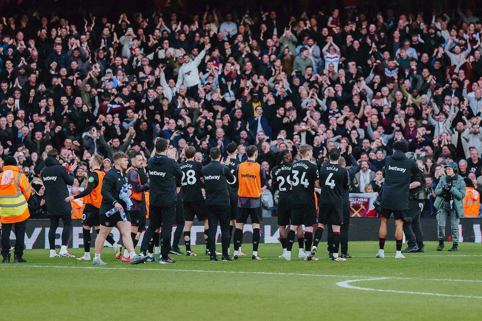 West Ham fans celebrate at Arsenal