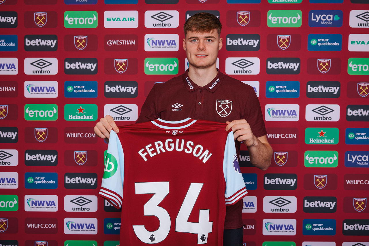 Evan Ferguson holds his West Ham United shirt