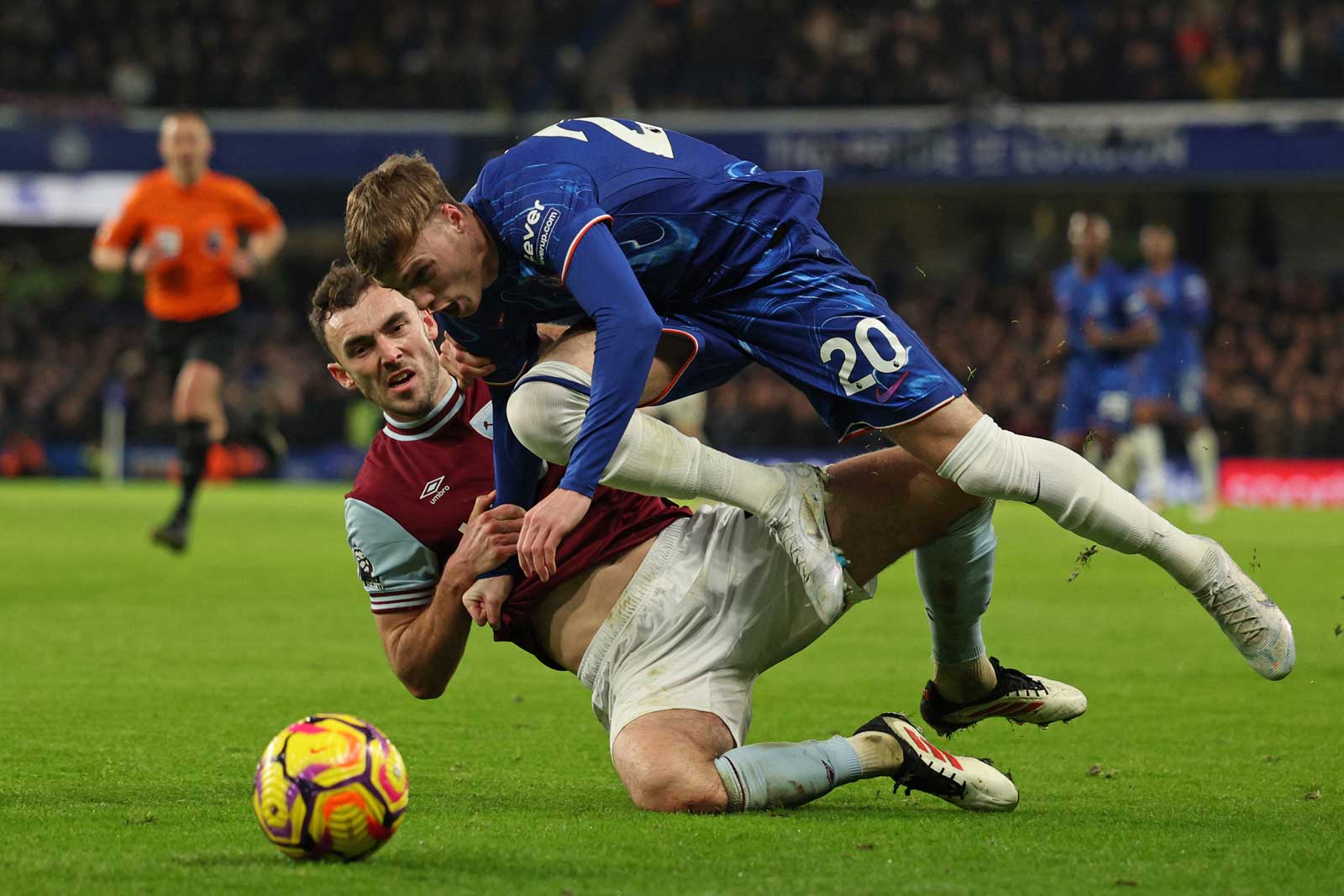 Andy Irving battles with Chelsea's Cole Palmer