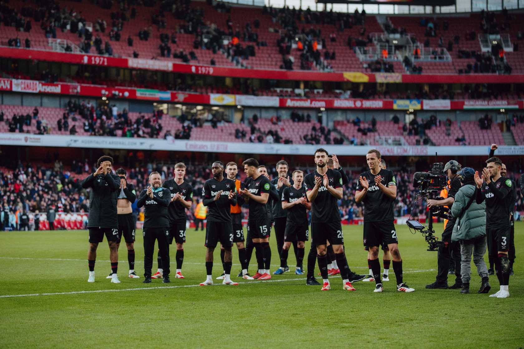 Ward-Prowse and his Hammers teammates celebrate victory at the Emirates with the travelling supporters at full-time