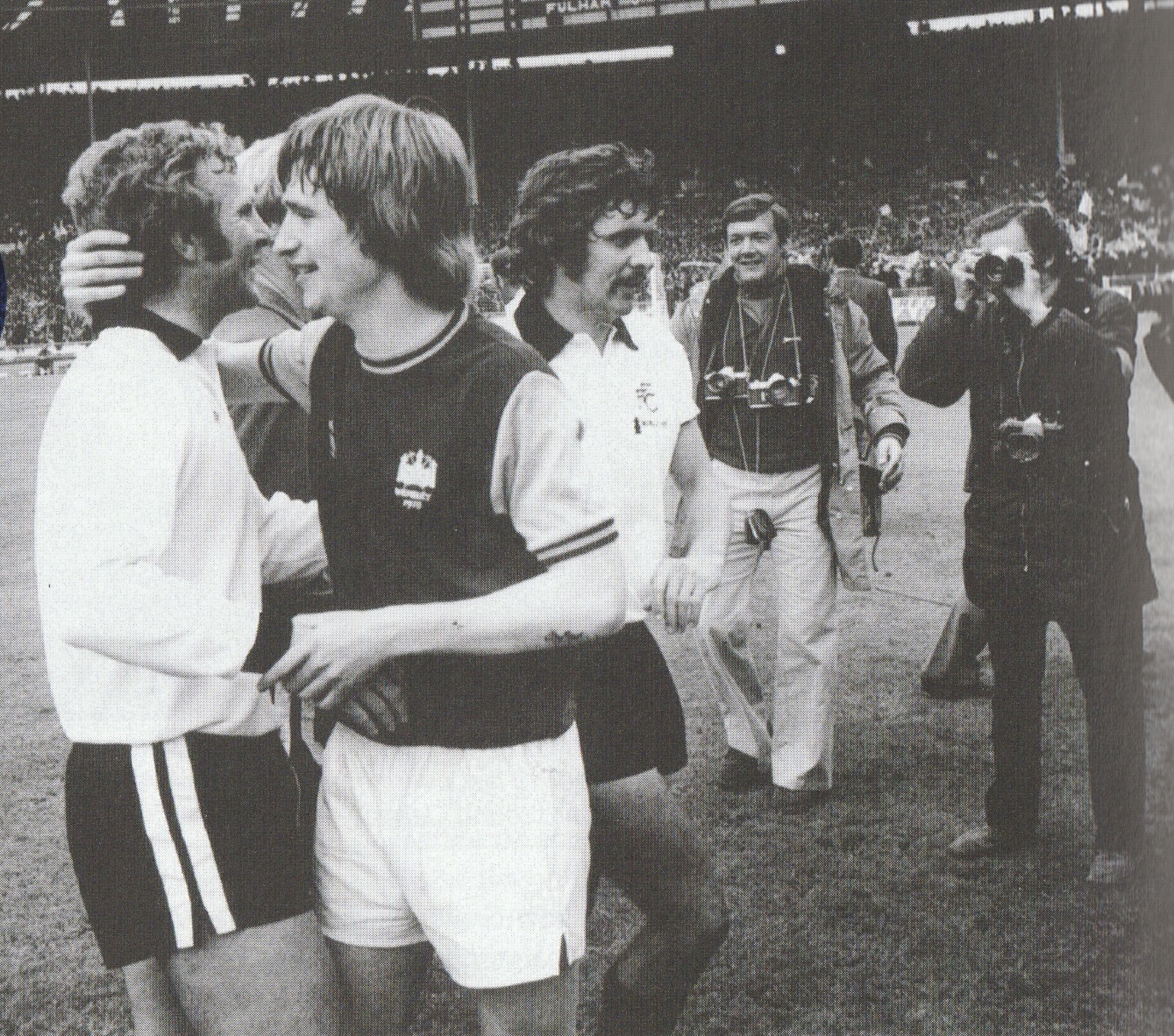 Kevin Lock commiserates with Bobby Moore at the final whistle