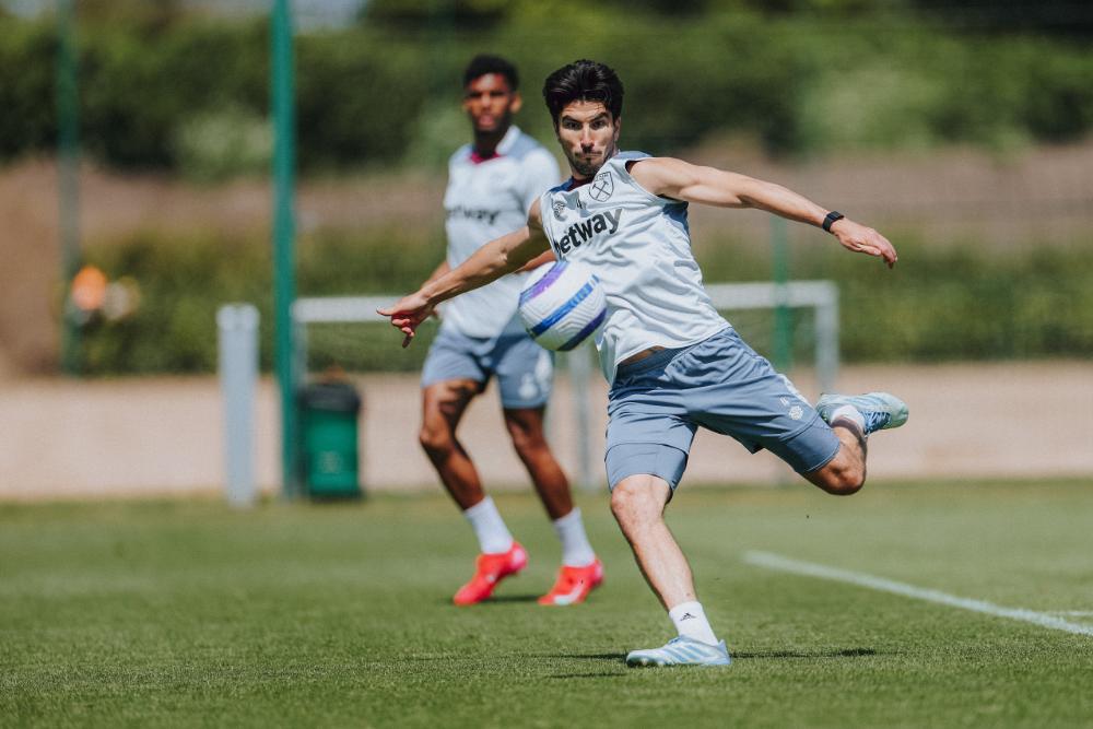 Carlos Soler strikes the ball in training