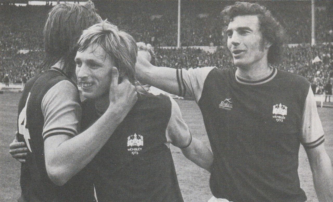 Sir Trevor Brooking celebrates winning the FA Cup in 1975 with Alan Taylor