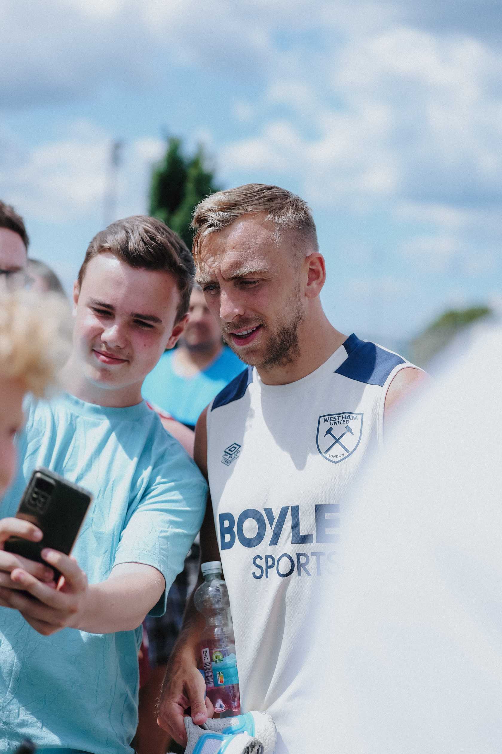 Jarrod Bowen with a supporter in Germany