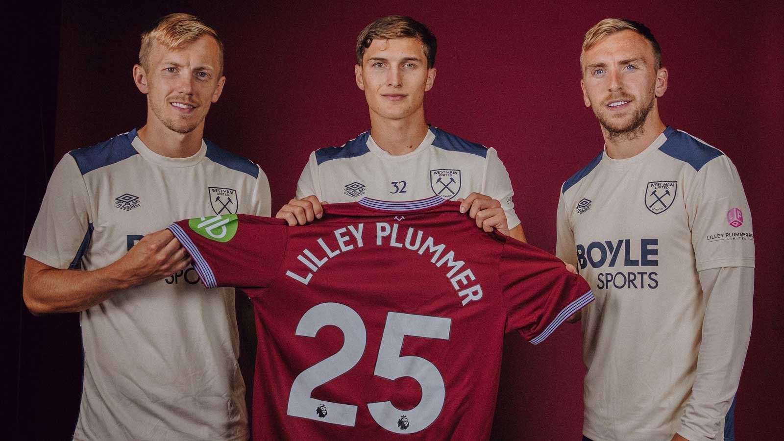 West Ham United players hold a shirt with Lilley Plummer printed on the back