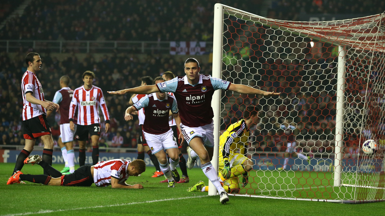 Andy Carroll celebrates scoring at Sunderland in March 2014