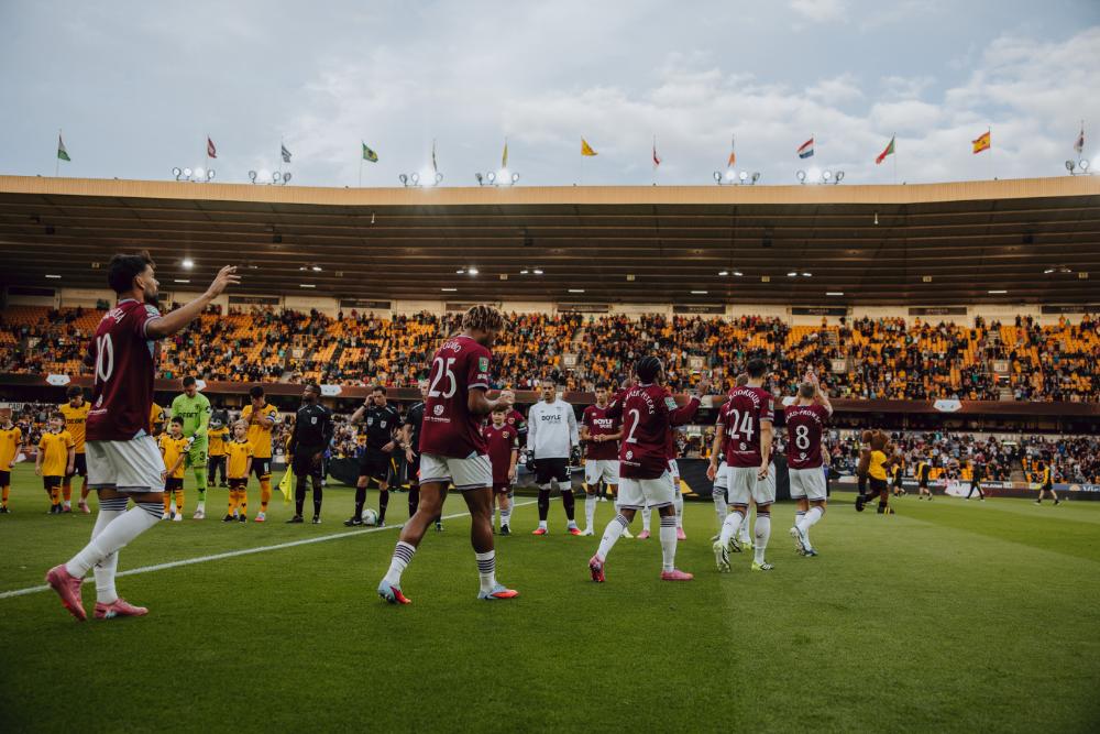 The teams head to the pitch at Molineux