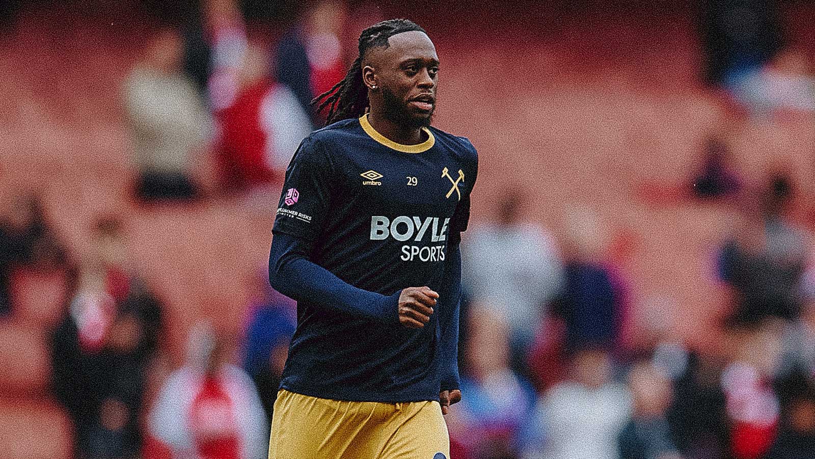 Aaron Wan-Bissaka warms-up ahead of West Ham United's game at Arsenal