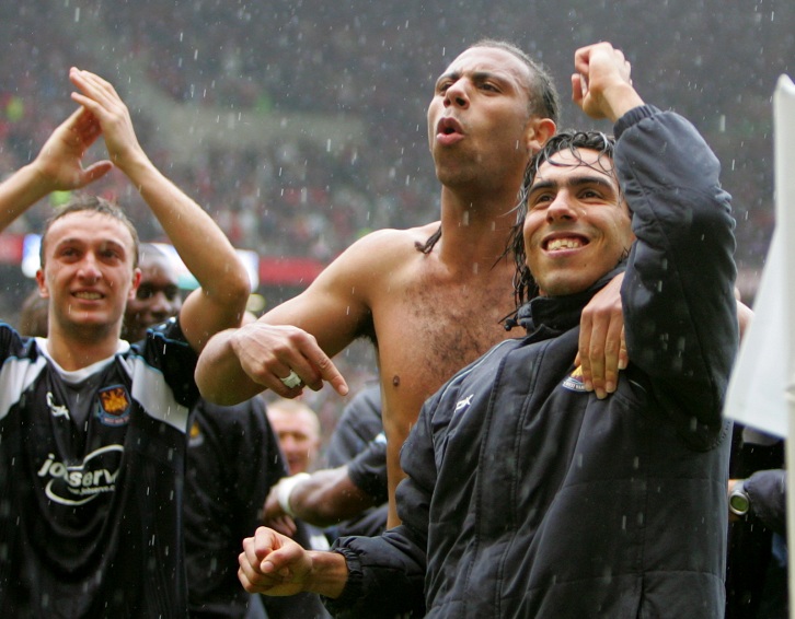 Mark Noble, Anton Ferdinand and Carlos Tevez celebrate victory at Old Trafford