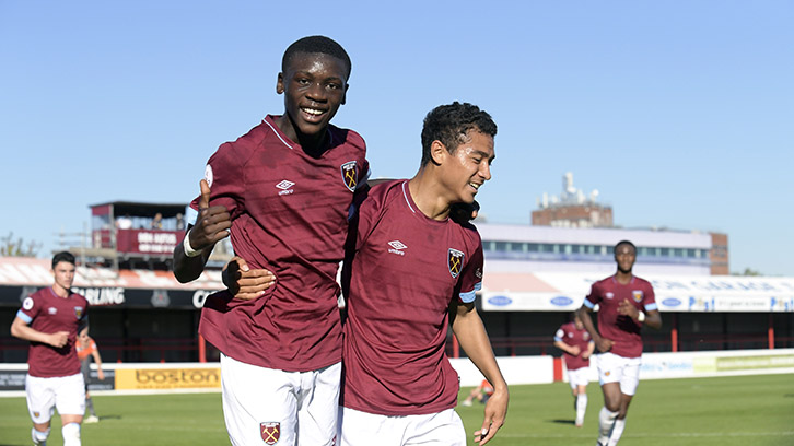 Goalscorer Veron Parkes (right) celebrates his goal with Emmanuel Longelo