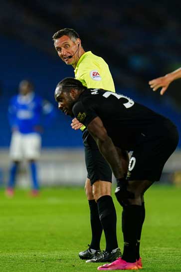 Andre Marriner and Michail Antonio