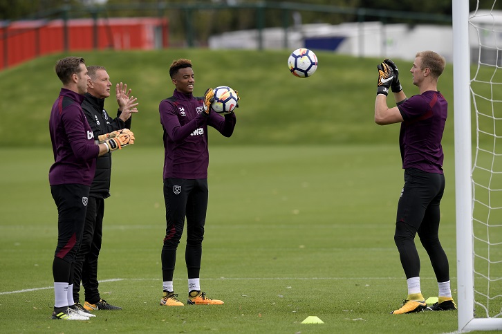 Chris Woods works with Adrian, Nathan Trott and Joe Hart in training