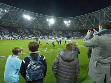 The youngsters watched the Hammers warm-up from pitchside