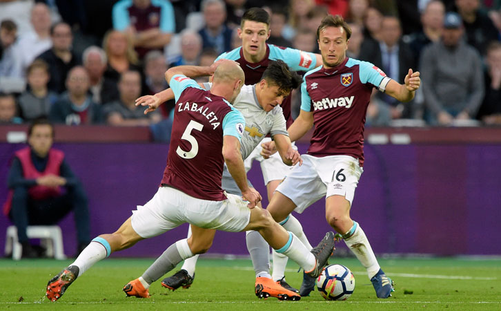 Pablo Zabaleta, Declan Rice and Mark Noble keep tabs on Alexis Sanchez