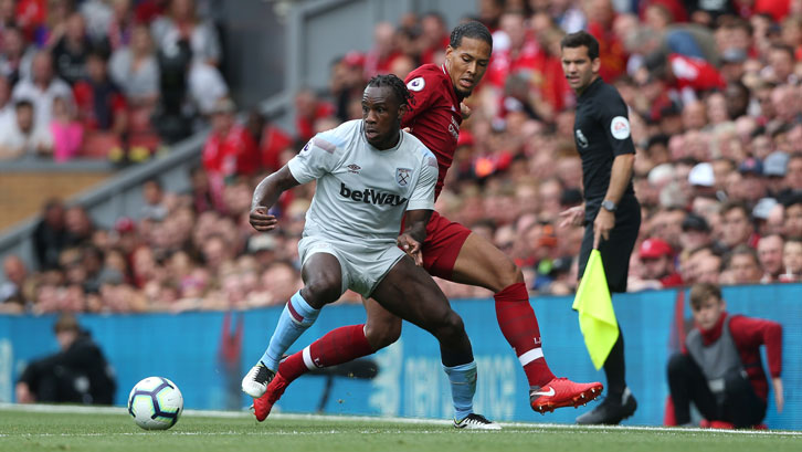 Michail Antonio holds off Liverpool defender Virgil van Dijk