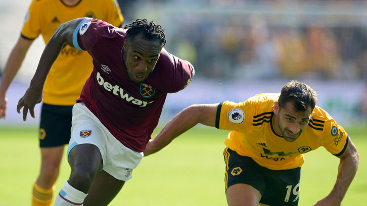 Michail Antonio battles for possession against Wolverhampton Wanderers