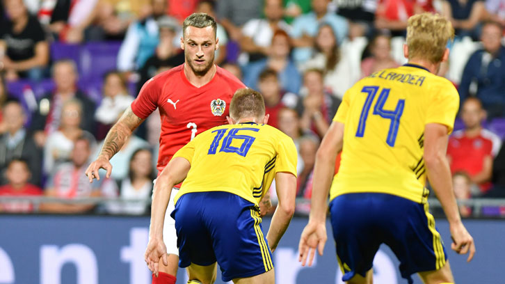 Marko Arnautovic takes on the Sweden defence