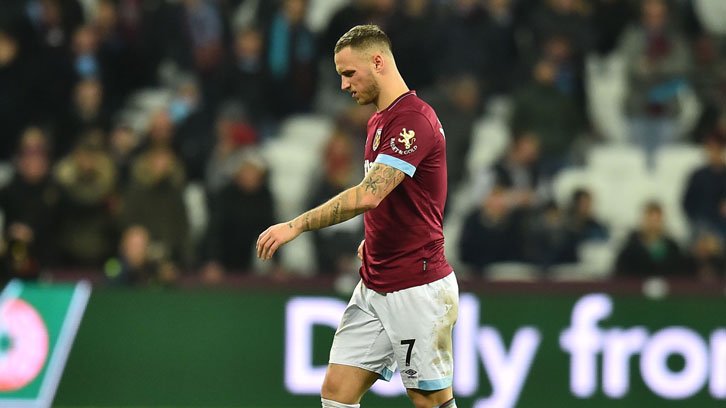 A dejected Marko Arnautovic trudges off the pitch at London Stadium