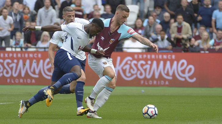 Serge Aurier pulls Marko Arnautovic's shirt inside the Tottenham penalty area