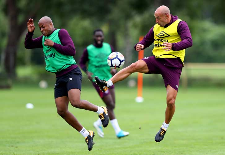 Andre Ayew battles with Pablo Zabaleta in training