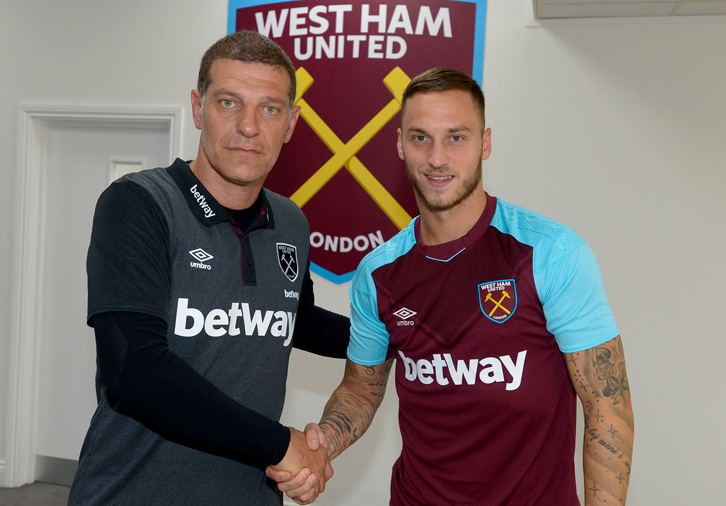 Slaven Bilic shakes Marko Arnautovic's hand