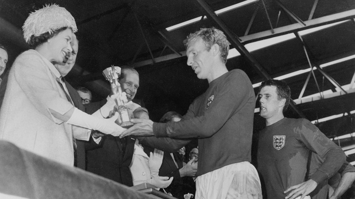Her Majesty The Queen presents Bobby Moore with the Jules Rimet Trophy in 1966