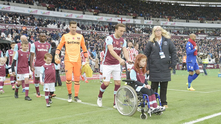 Brooke and Mark Noble lead the Hammers out at London Stadium