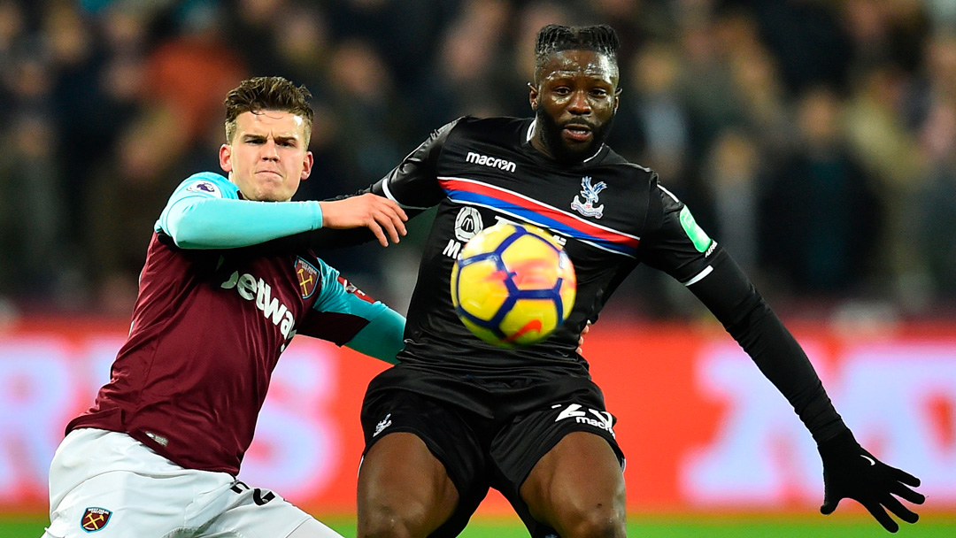 Sam Byram tussles with Bakary Sako