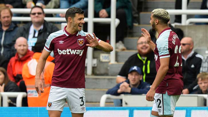 Aaron Cresswell celebrates with Said Benrahma