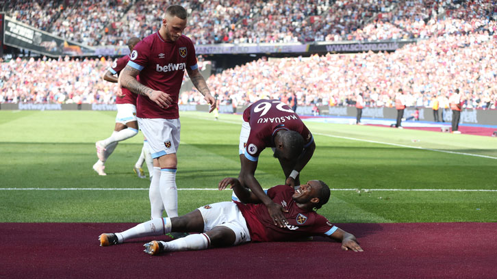 Michail Antonio celebrates with the Claret pitch surround