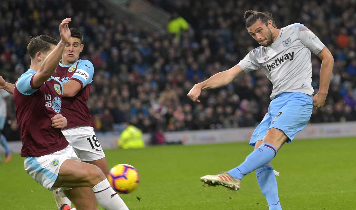 Andy Carroll fires in a shot at Burnley