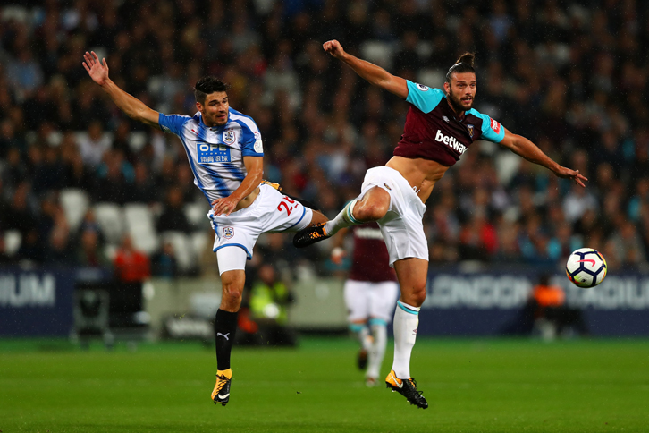 Andy Carroll in action against Huddersfield