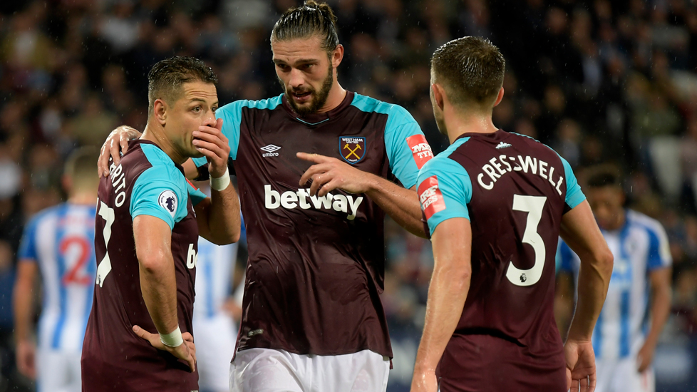 Andy Carroll and Chicharito in discussion against Huddersfield